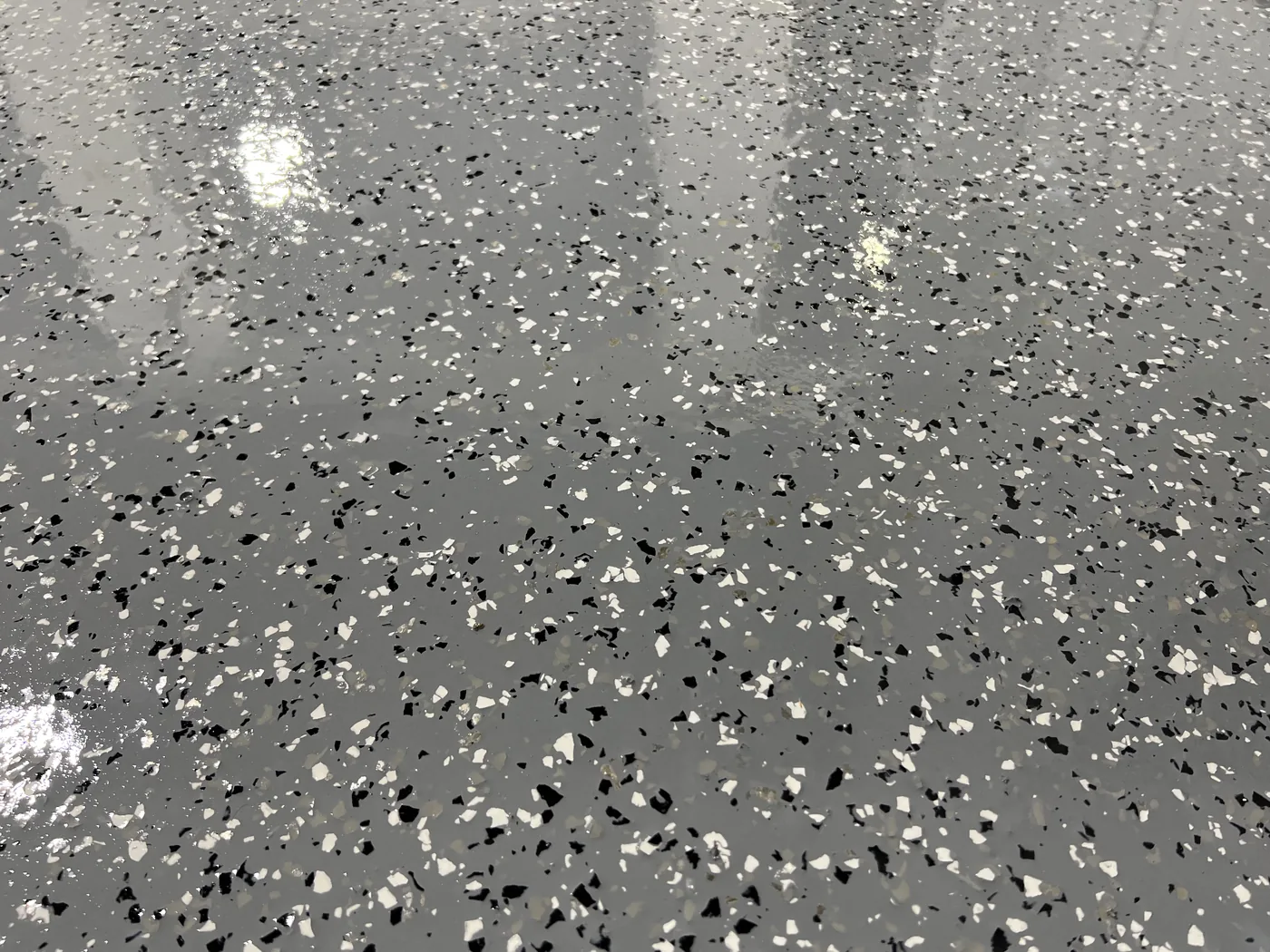 Decorative flake epoxy floor project by 1st Epoxy